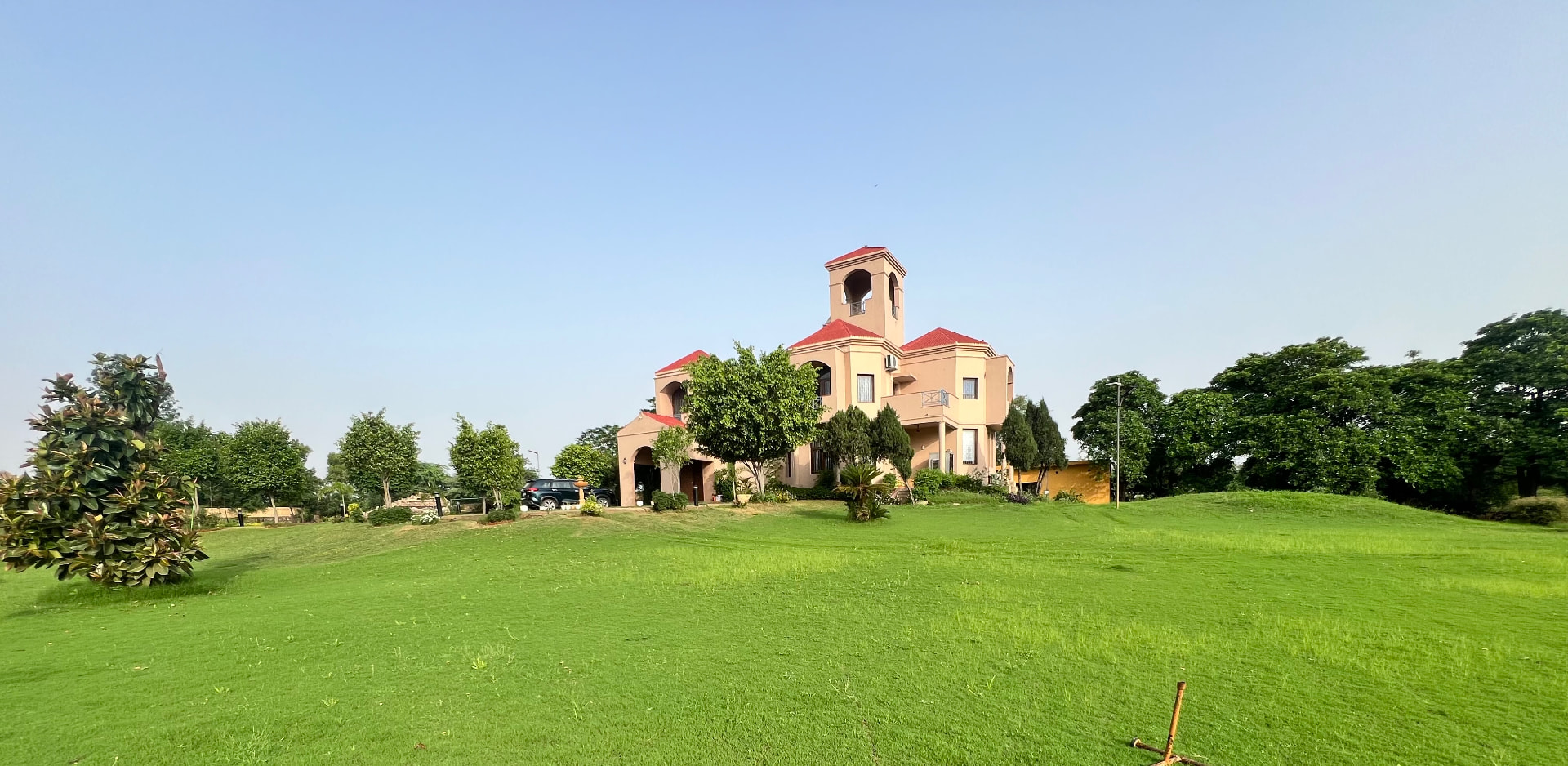 The villa seen across the front lawn